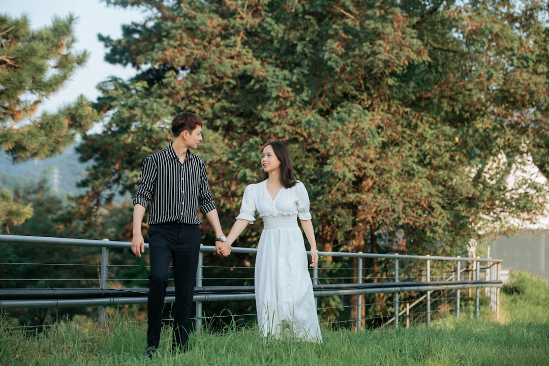 person holding clipboard in empty apartment