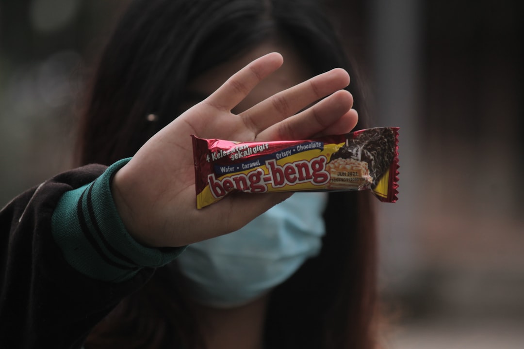 person holding clipboard in empty apartment